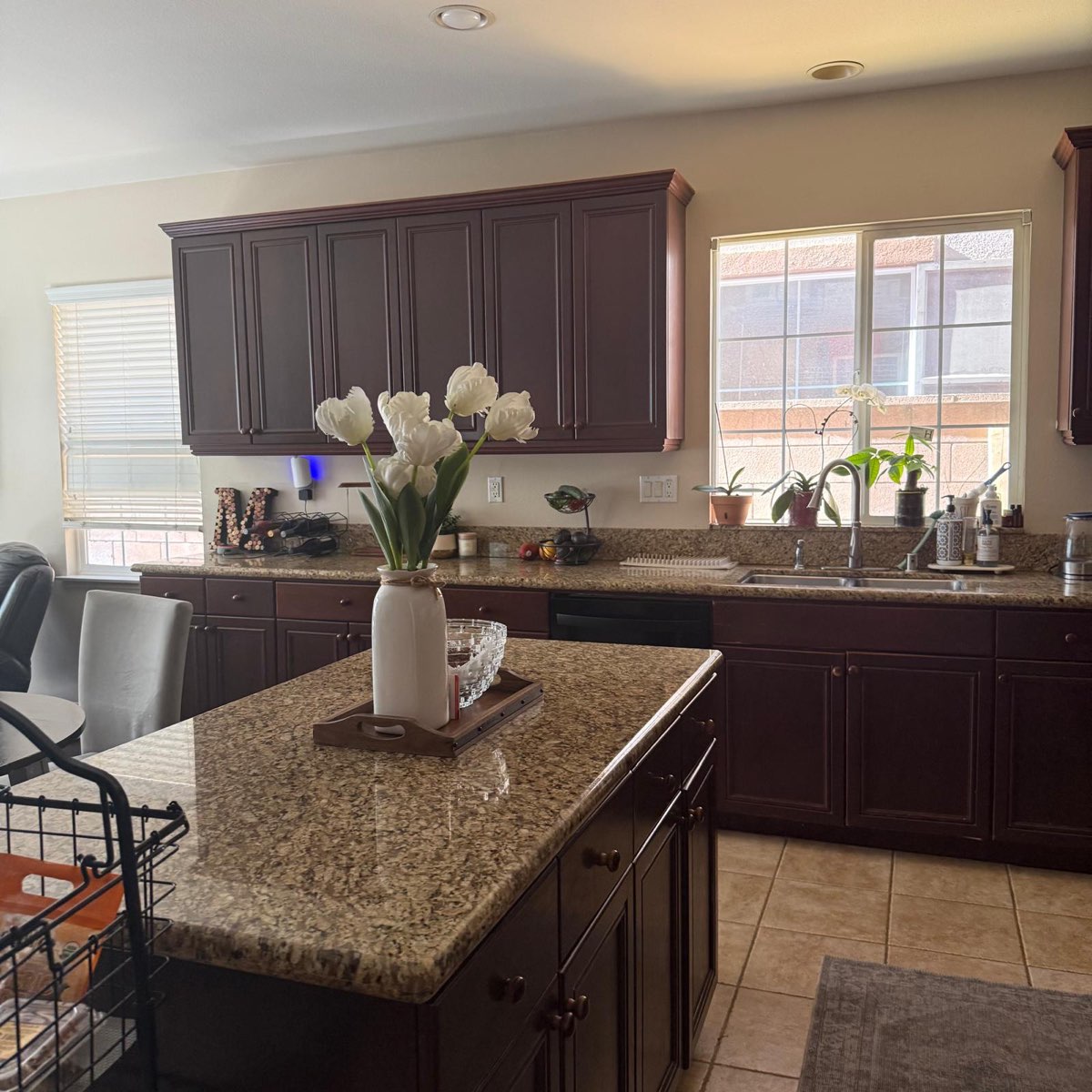 The same kitchen after cleaning — counters clear, surfaces shining