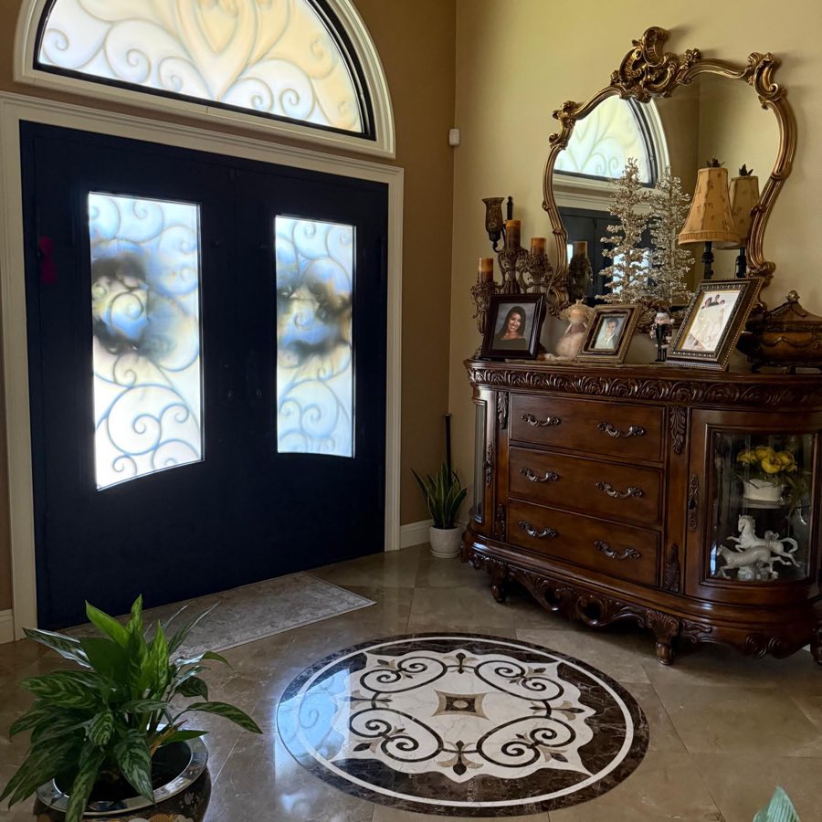 Estate entry with marble medallion floor